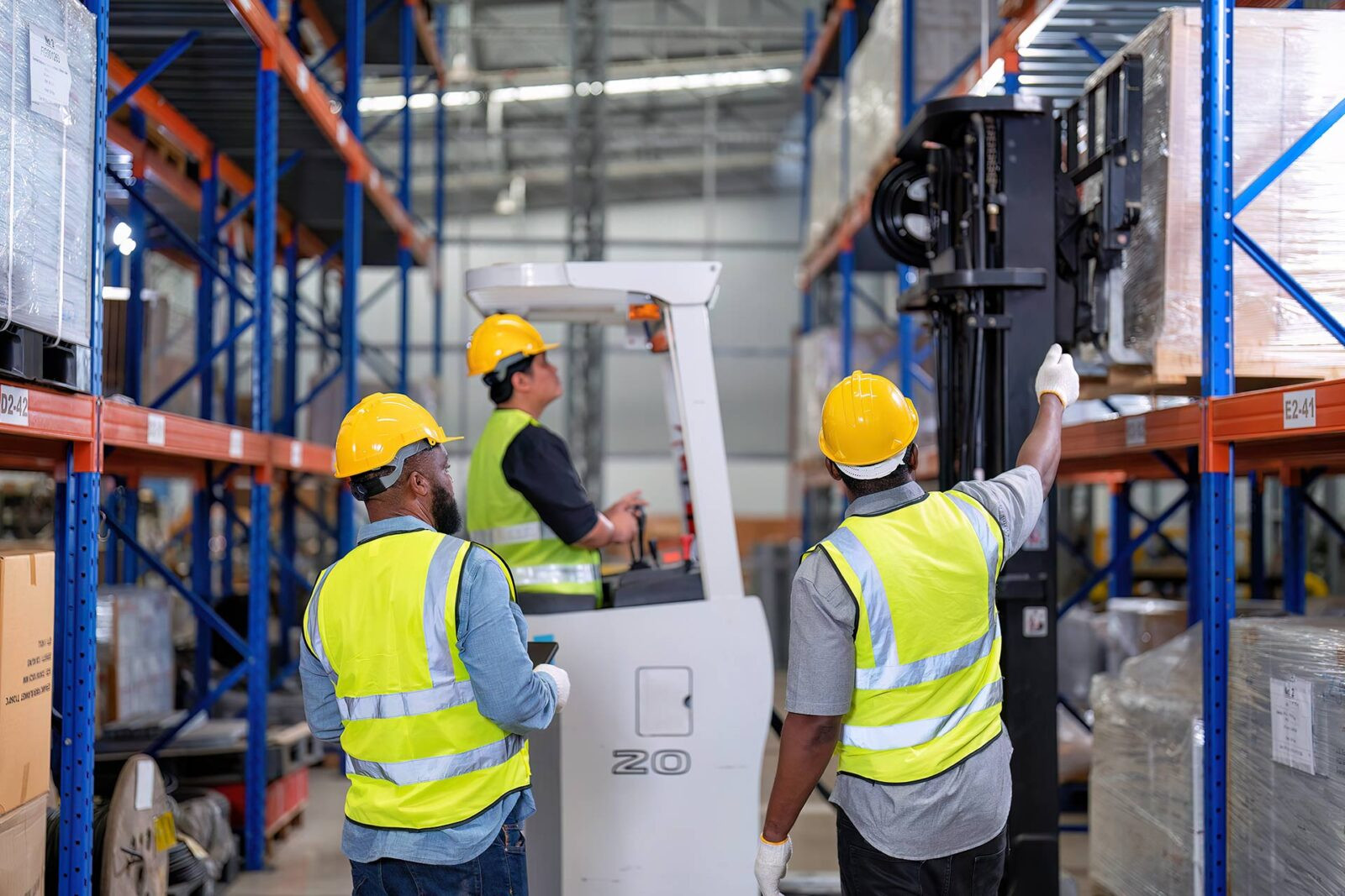 Warehouse worker inspecting structural racking